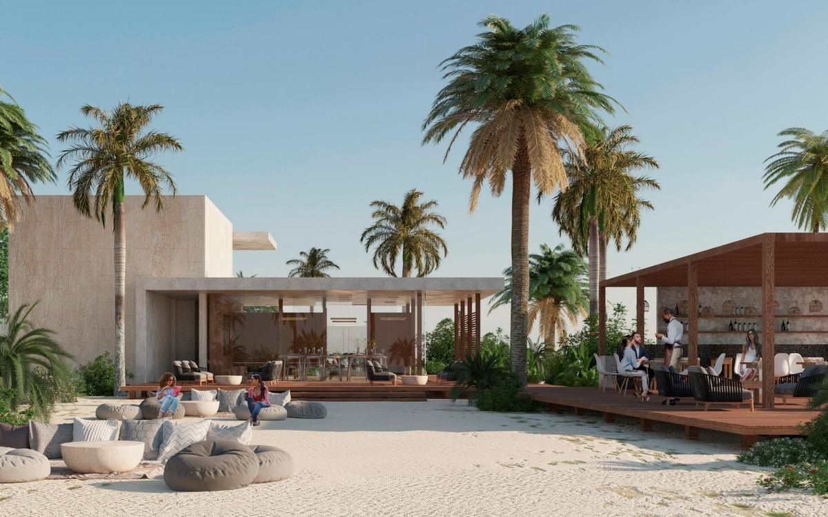 Xpu-Ha Beach owners' beach club with loungers and palm trees